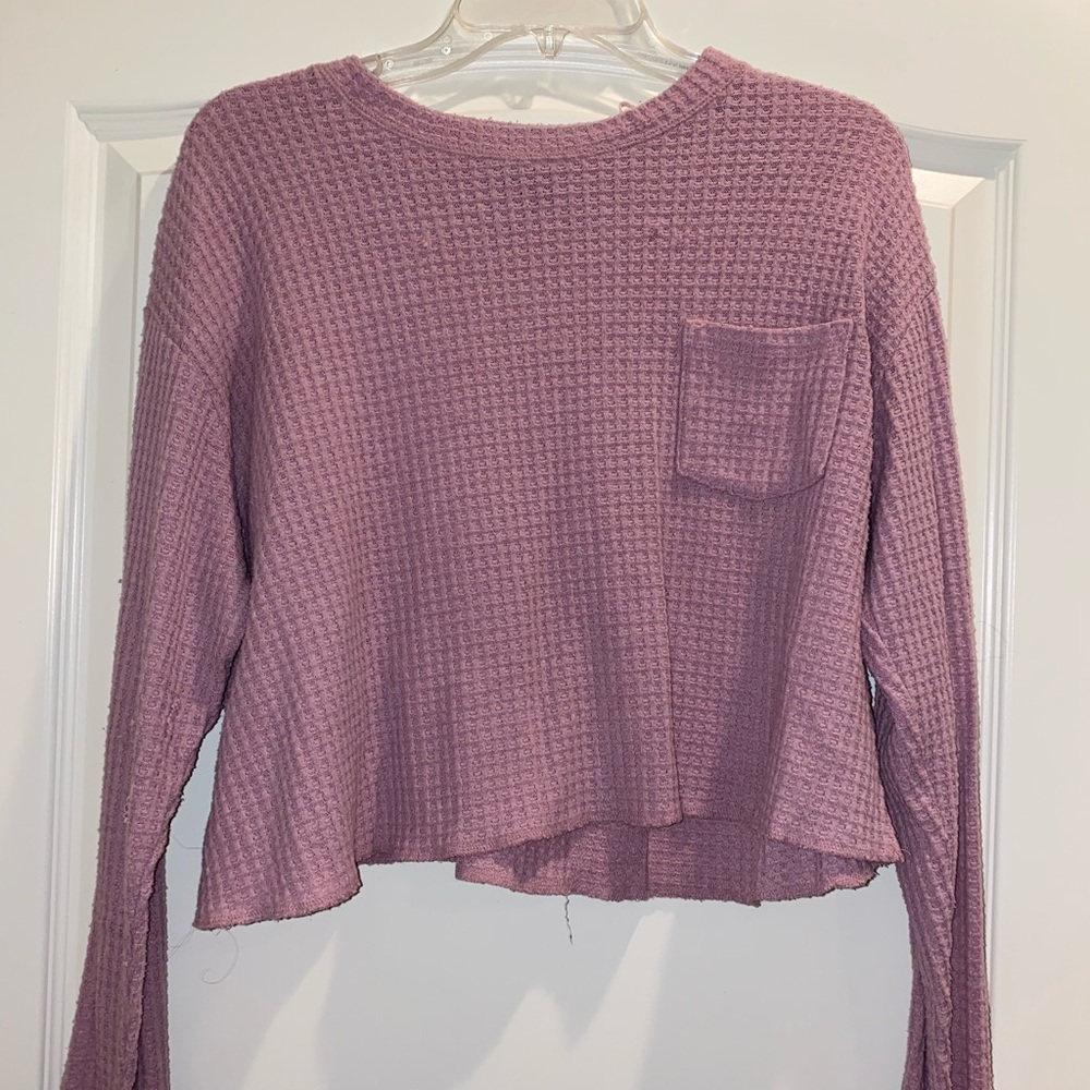 Distressed pink long sleeve crop top